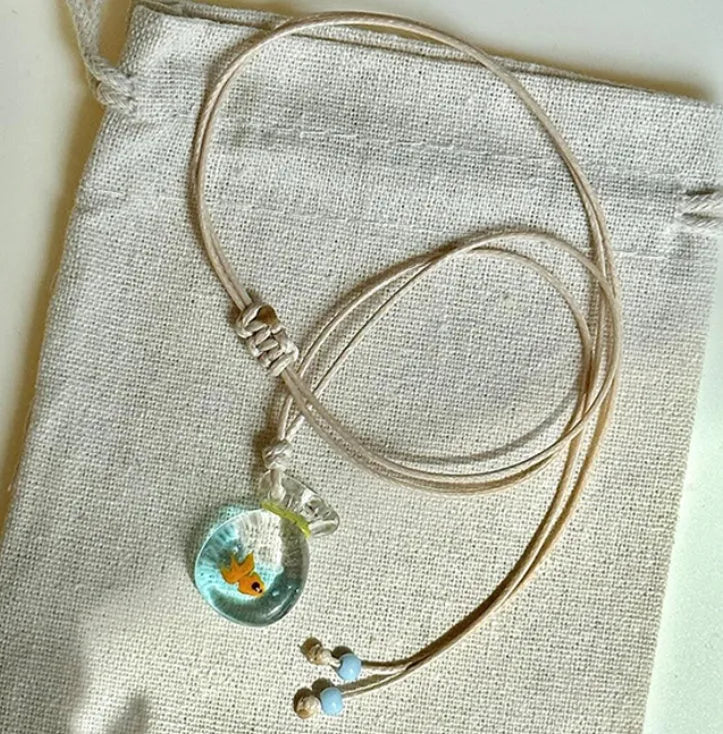 Women's necklace with coloured glaze skirt pendant on cotton linen clavicle chain