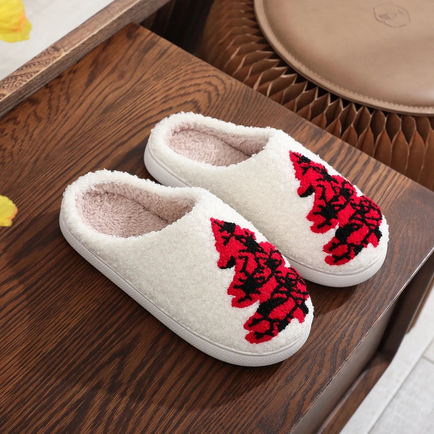 Pair of Christmas tree patterned slippers with plush upper and plastic non-slip sole
