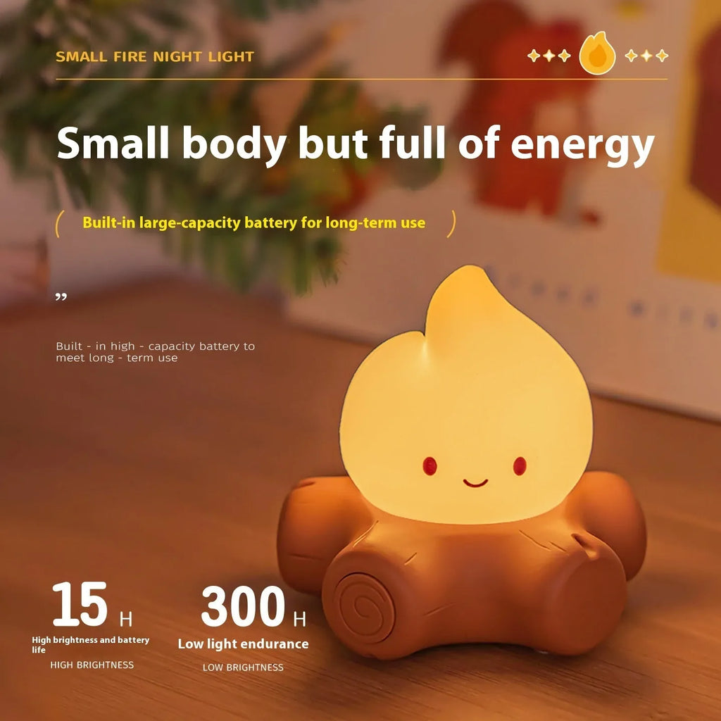 Cartoon-style small fire pile silicone night lamp with yellow light display on dark surface