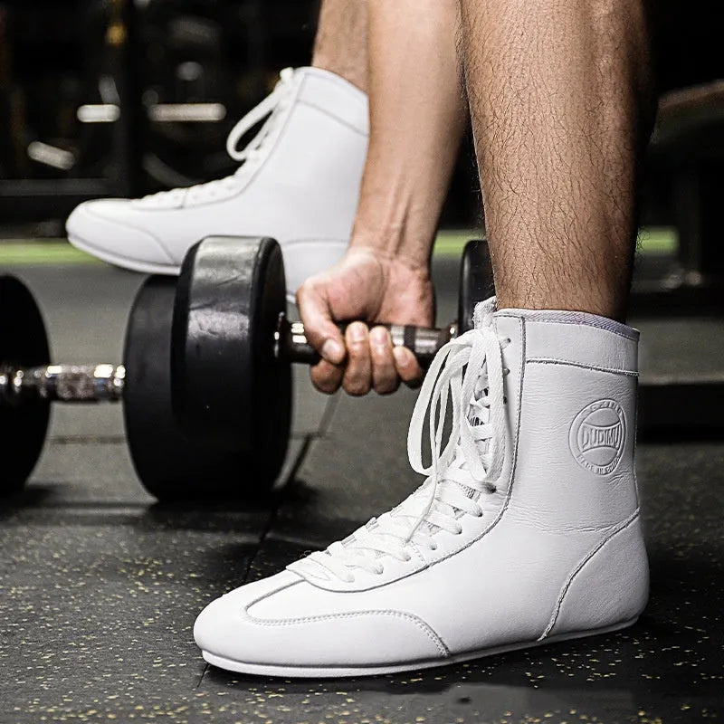 Black gold mesh professional boxing shoes with white leather accents and rubber sole