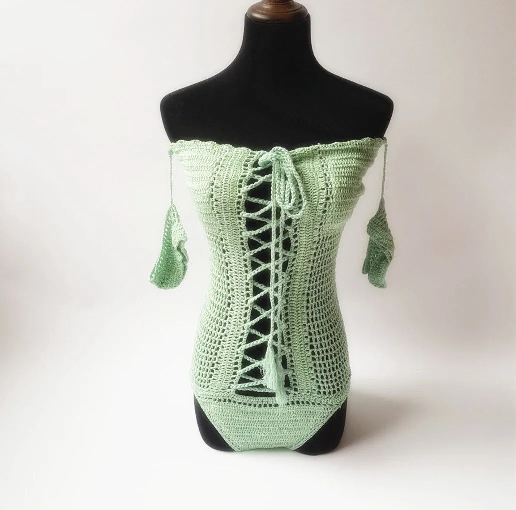 Off-shoulder one-piece swimsuit in light pink on a mannequin