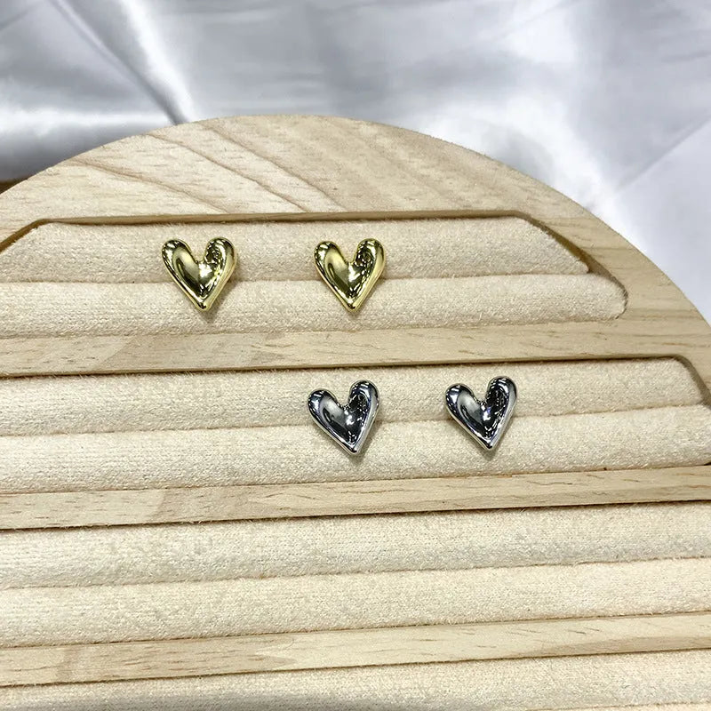 Simple heart-shaped metal drop earrings in gold and silvery colour options