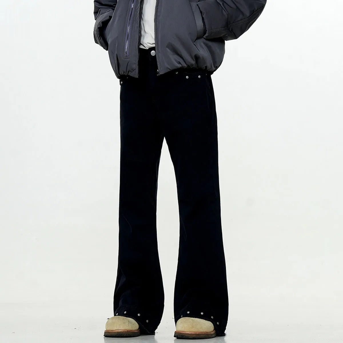 Black American retro straight-leg skinny jeans on a hanger, showing mid-waist and zipper fly detail.