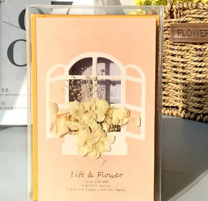 Handmade 3D butterfly-shaped greeting card with artificial flowers in a box, alongside its matching envelope.
