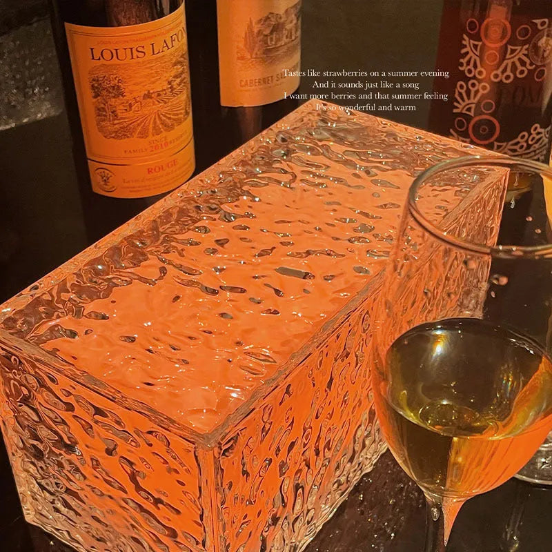 Geometric ice cube shaped acrylic night lamp with colour changing lights on wooden surface