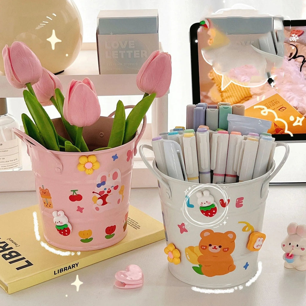 Round metal desk pen holder with iron art design in colour options including pink, green, red, white, and yellow