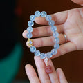 Aquamarine gemstone and components for a DIY Fengjiu Chinese style bracelet kit for women.