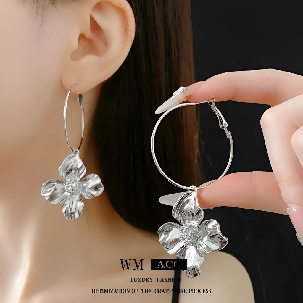 Vintage silver and gold metal flower earrings with geometric shapes and electroplated finish.