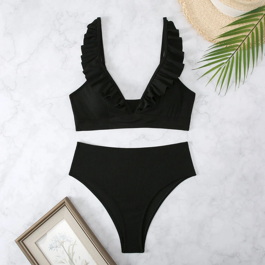 Retro striped split bikini swimsuit in black and white stripes on mannequin