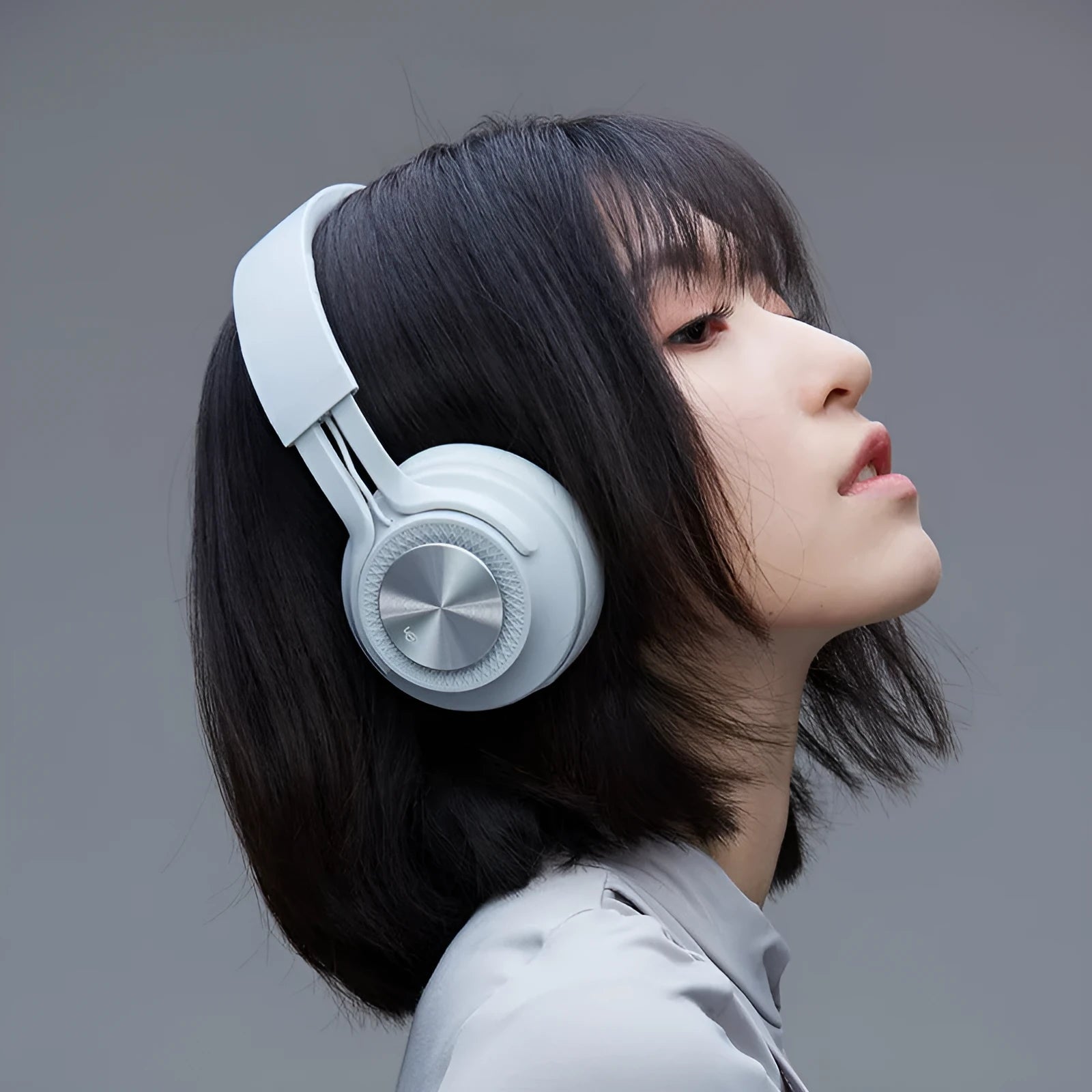 Red wireless Bluetooth sports headset with over-ear design on a grey background