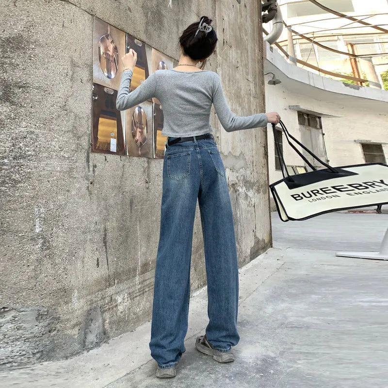 A pair of women's high waist straight leg jeans in retro blue cotton denim.