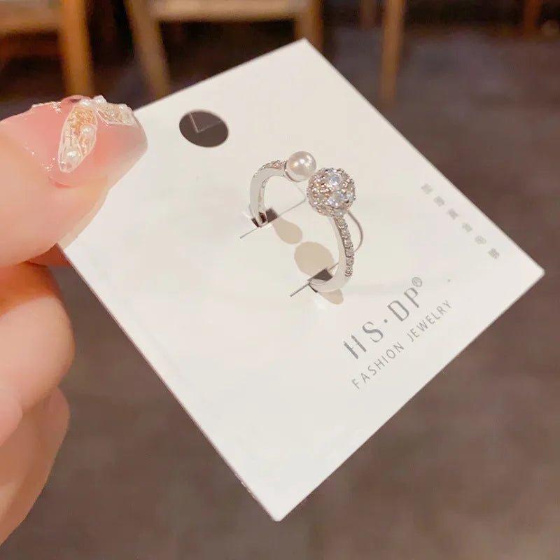 Round zircon open-end pearl ring in gold or silver colour with thick real gold plating over copper