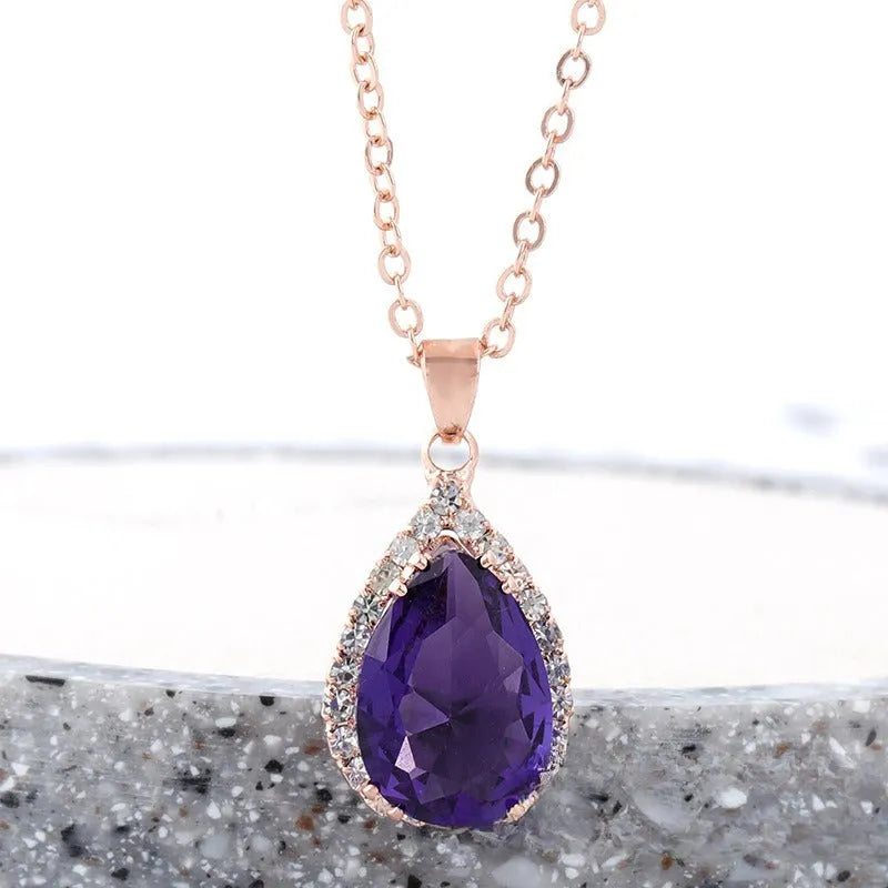 Women's drop-shaped pendant necklace with rhinestone geometric pattern in pink electroplated finish