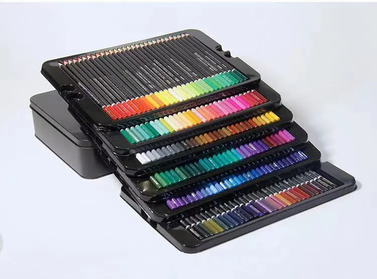 Metal tin box open to show a rainbow assortment of oily colour pencils with wooden barrels.