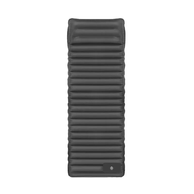 Single-size portable inflatable camping mattress in grey on a tent floor