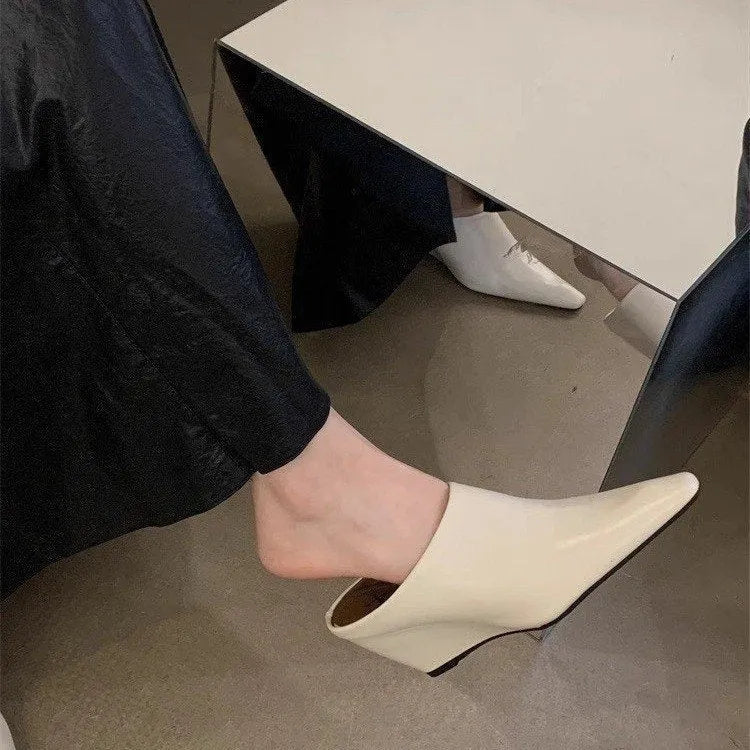 Women's Wind Wedge closed toe half slippers in PU with wedge sole, shown in black, brown, and off white colour options
