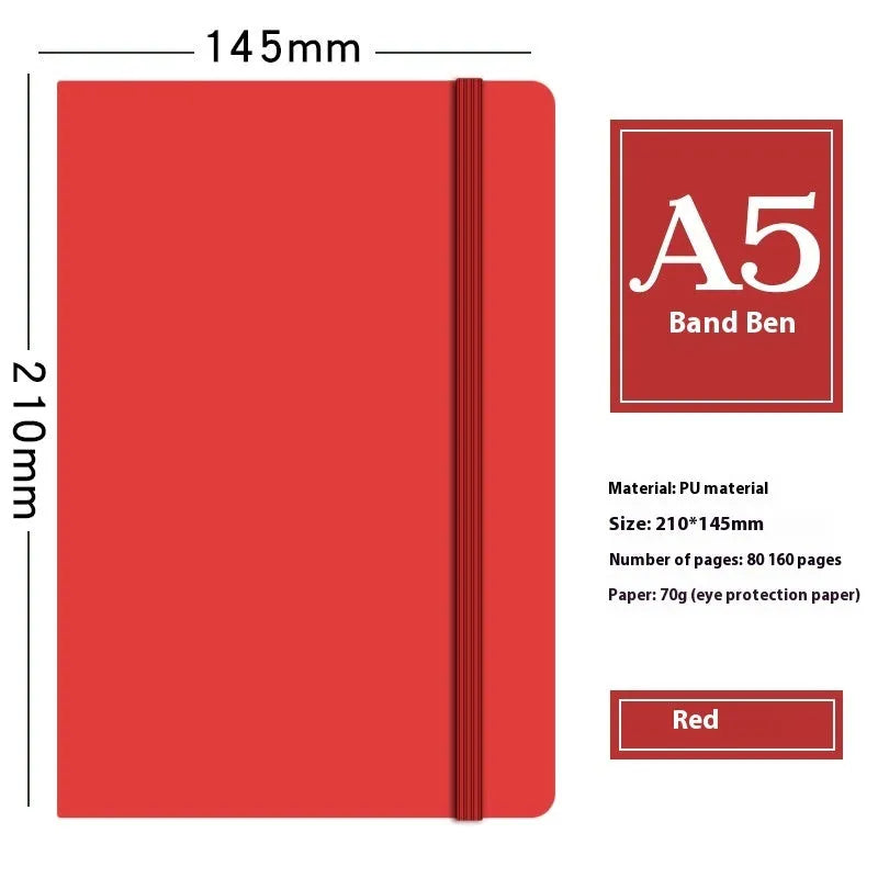 A5 faux leather notebook with pen insert and strap, open on a desk showing lined pages