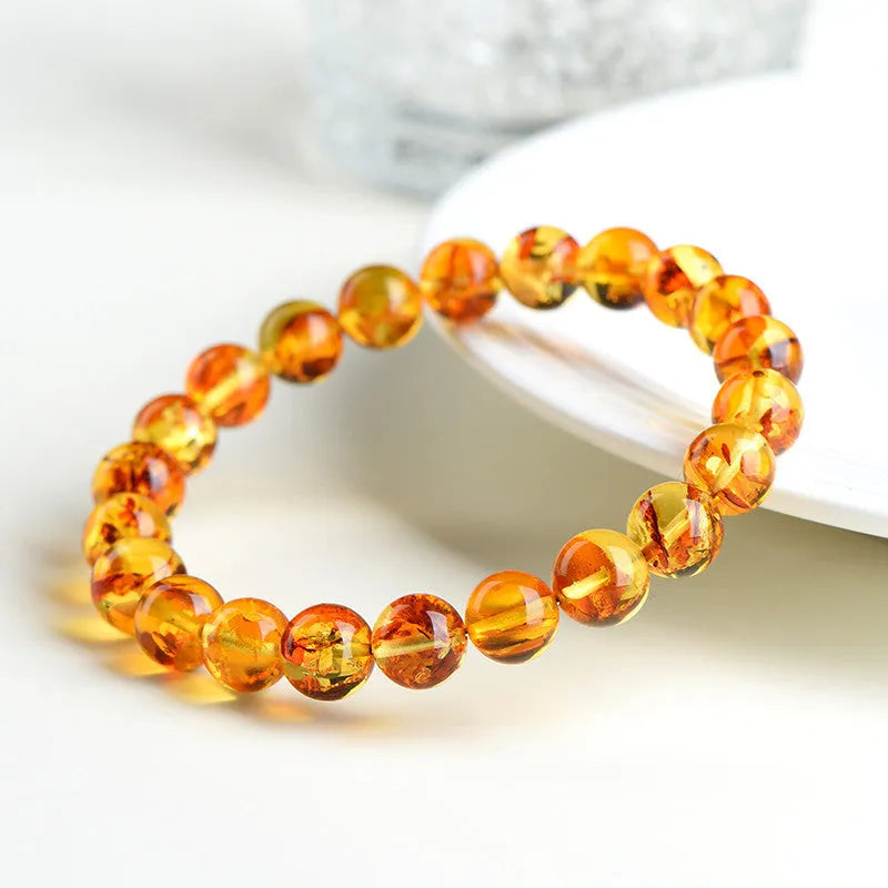 Natural yellow piebald amber bracelet with geometry beads showing flower spot patterns