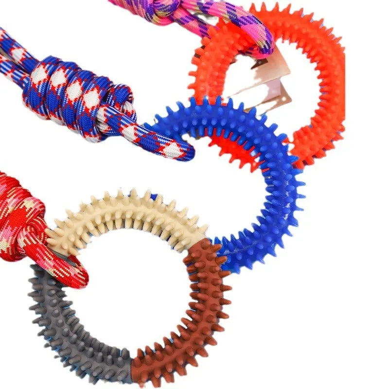 Blue braided rope dog toy with a knot, shown on a wooden floor.