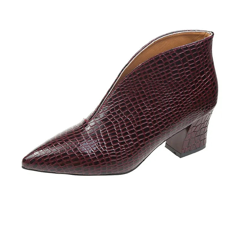 Women's black Martin boots with V-cut pointed toe, embossed artificial PU upper, and chunky heel