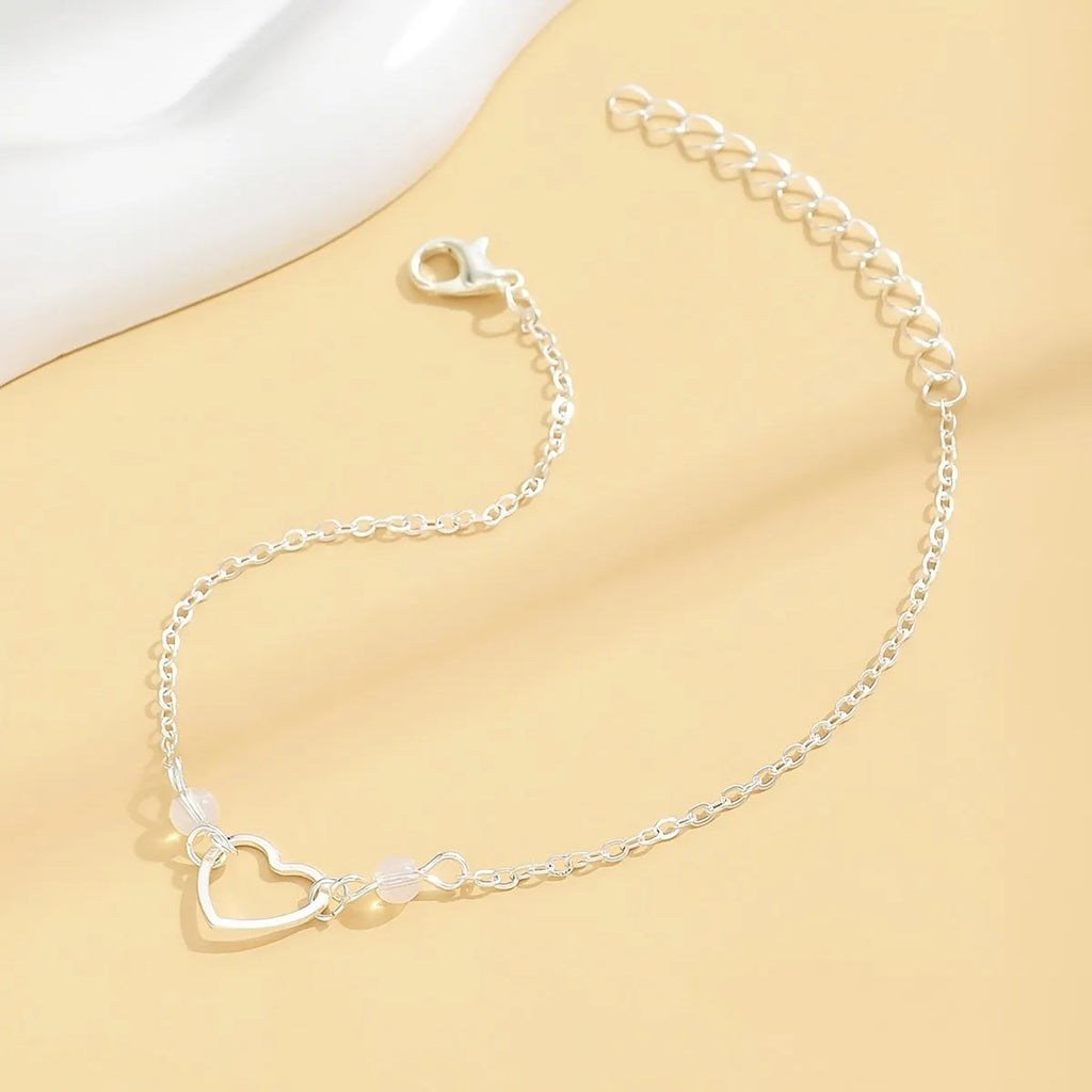 Adjustable gold or silver alloy anklet with heart-shaped pendant in simple geometric style