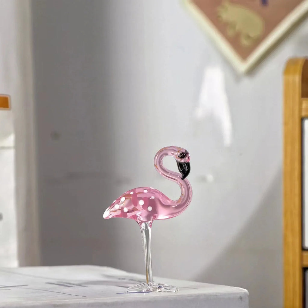 Pink and white crystal flamingo decorative ornament on a table, showing modern simple style.