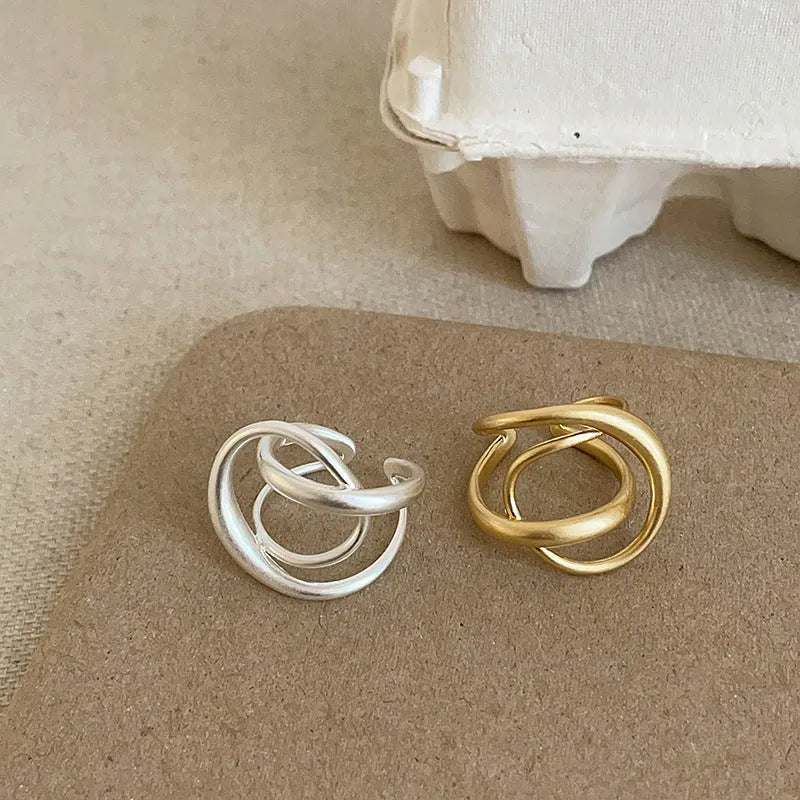 Women's geometric open ring with interlaced design in matte gold or silver tone metal