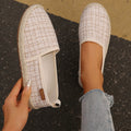Beige rope sole fisherman shoes with canvas uppers and flat heels
