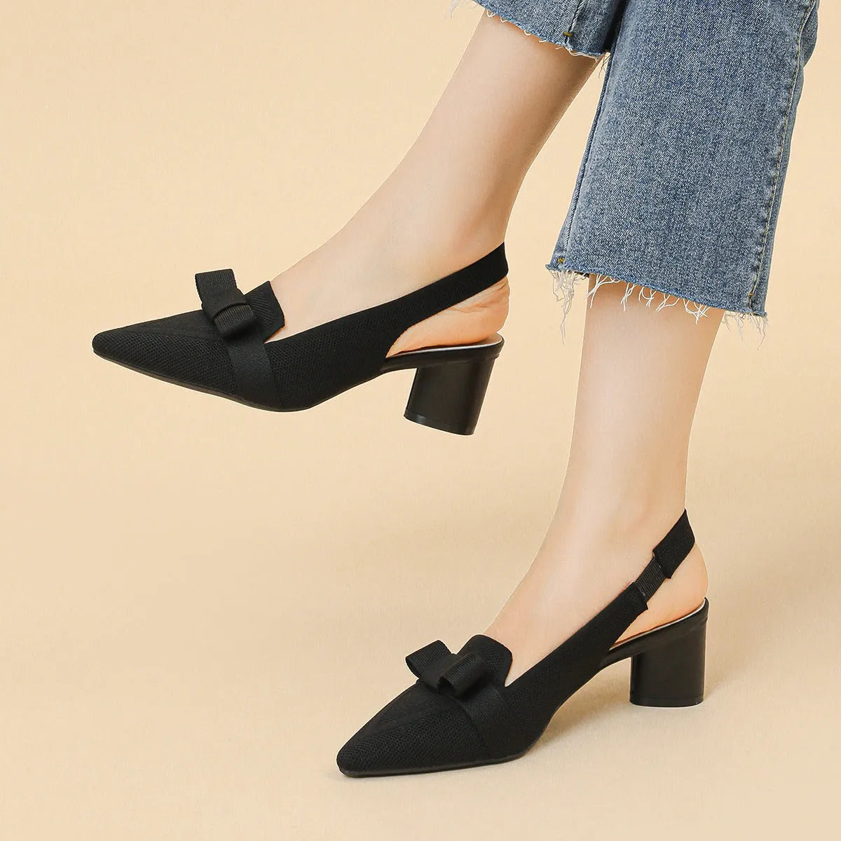 Women's closed toe high heel sandals with an ankle back strap in a pointed toe design on a rubber sole