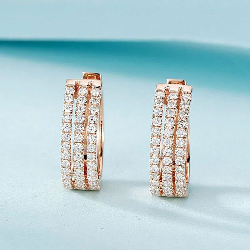 18K white gold natural diamond earrings with 56 point diamond in platinum finish on light background