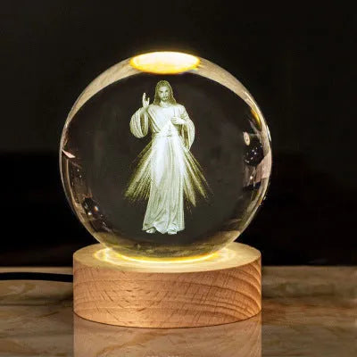 White crystal ball desk ornament with wood base and religious design inside