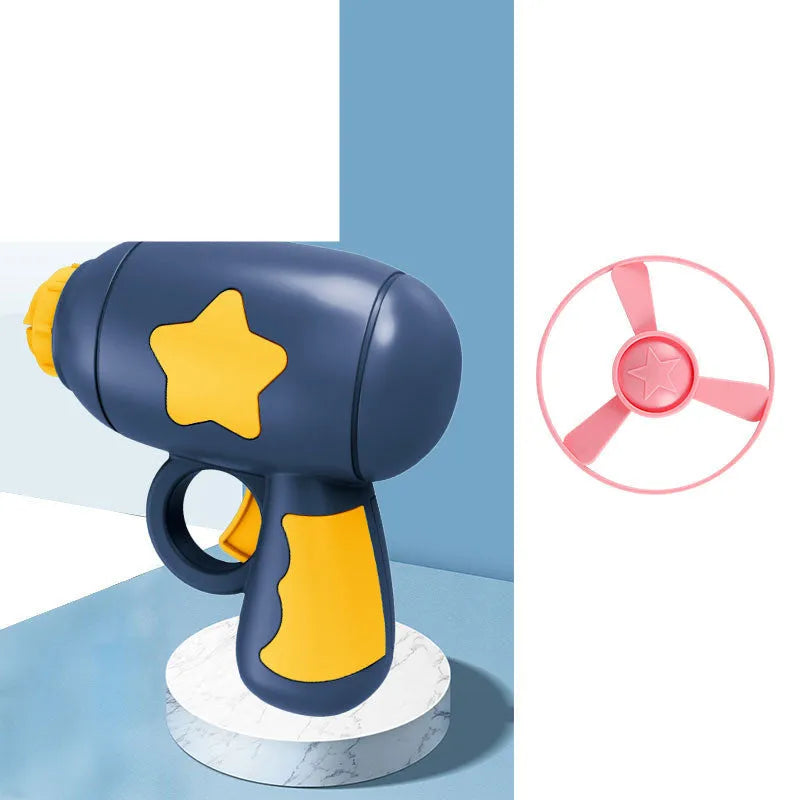 Blue flying saucer launcher gun and three LED flashing discs on a yellow background.