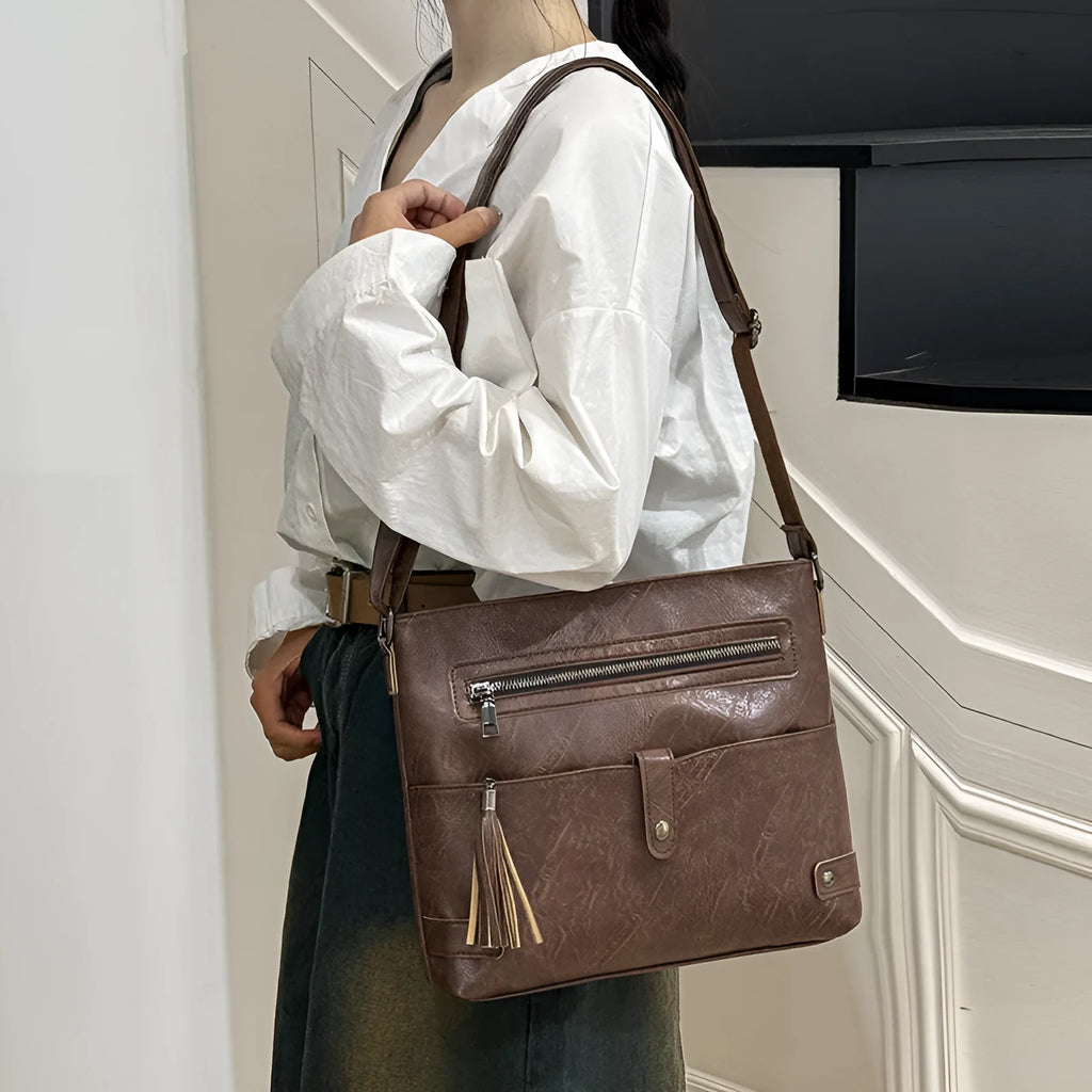 Women's soft PU tassel crossbody handbag in horizontal square shape with zipper compartments, available in beige, black, brown, coffee