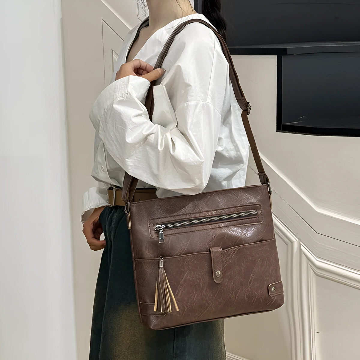 Women's soft PU tassel crossbody handbag in horizontal square shape with zipper compartments, available in beige, black, brown, coffee