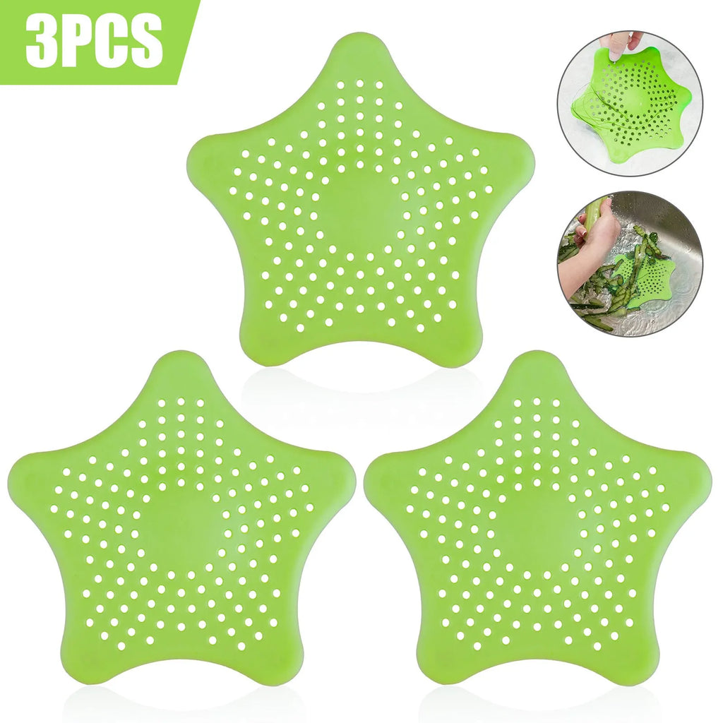 Three starfish-shaped TPR sink drain filters in blue, green, and white on a bathroom sink