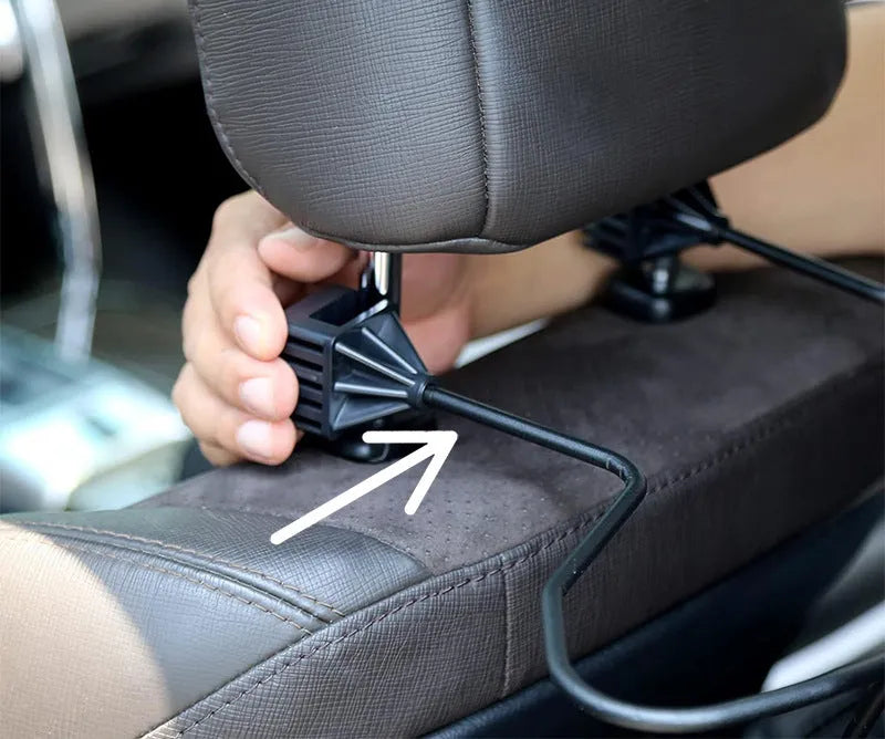 Black metal snap-on hat bracket for car interior display stand holding a hat
