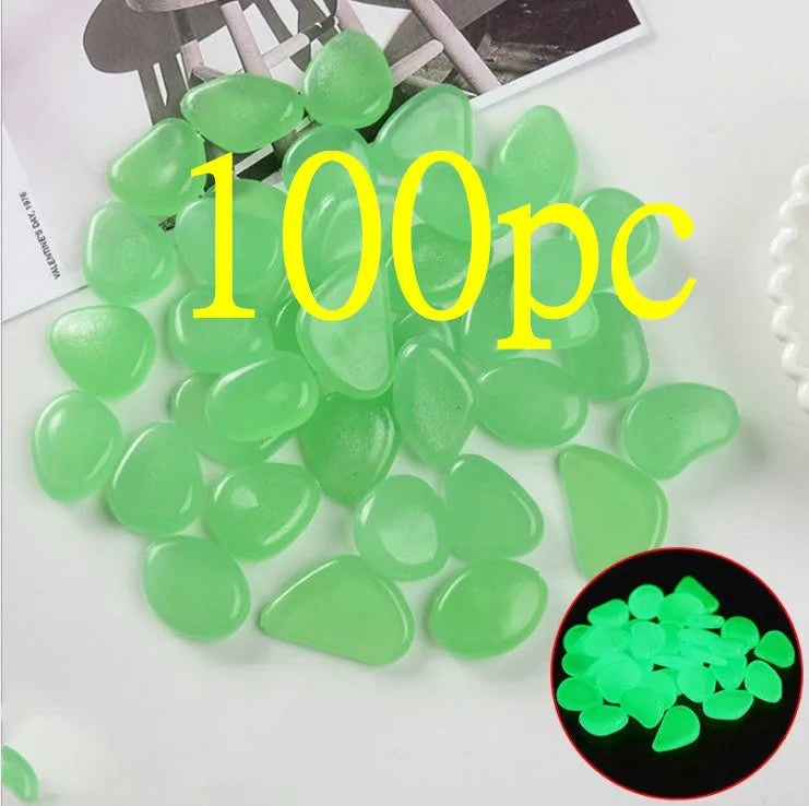 Luminous fluorescent aquarium and garden pebbles in mixed colours including dark purple, yellow, light blue, pink, orange