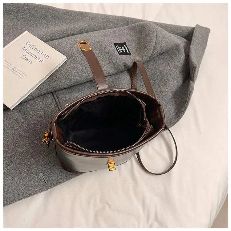 Women's PU handbag in simple style available in black, brown, and coffee colours in large and small sizes