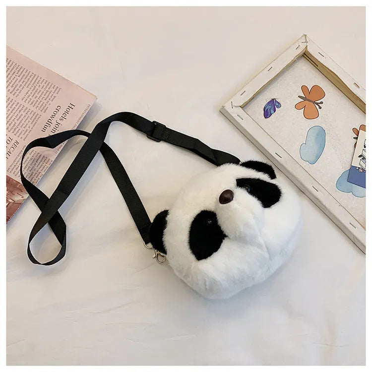 Soft plush cylindrical panda head crossbody bag with sandwich pocket.