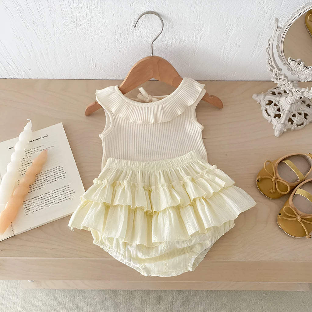 Beige cotton girls double layer bud-waisted shorts set with ruffled collar top on white background