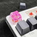 Transparent resin mechanical keyboard keycap with starry sky pattern in red, pink, green, and violet colour options
