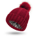 Women's knitted beanie hat with satin lining and faux fur pom pom in various colours