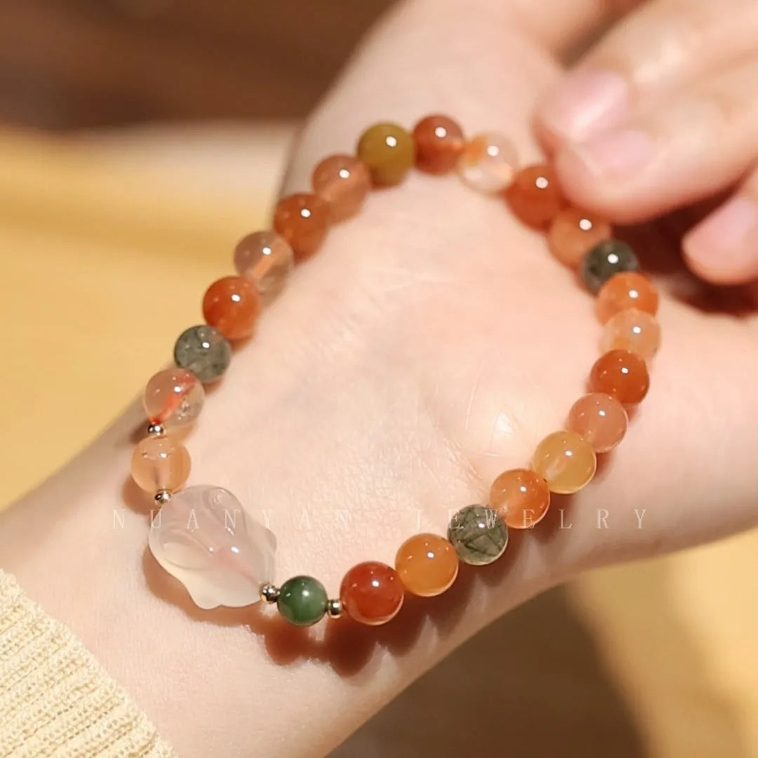 Handmade women's Hetian Jade Rabbit bracelet with glass rabbit charms in a gift box.