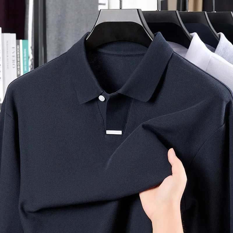 Men's grey loose fit cotton polo shirt with long sleeves and a lapel collar on a hanger.