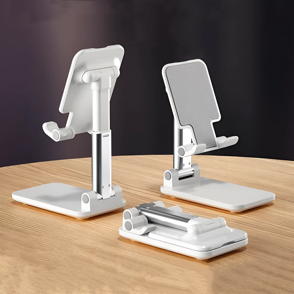 White folding telescopic mobile phone bracket holding a smartphone on a desktop.