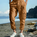 Men's casual linen trousers in solid colour with ankle ties and multiple pockets, loose fit, drawstring waist.
