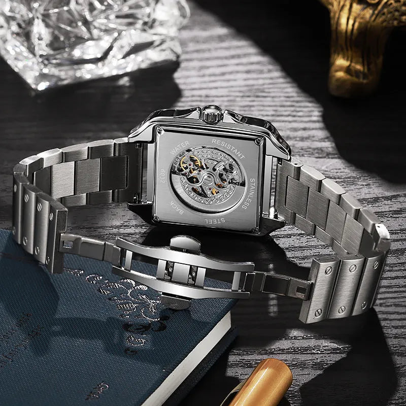 Men's square stainless steel automatic watch with diamond bezel on a black leather strap.