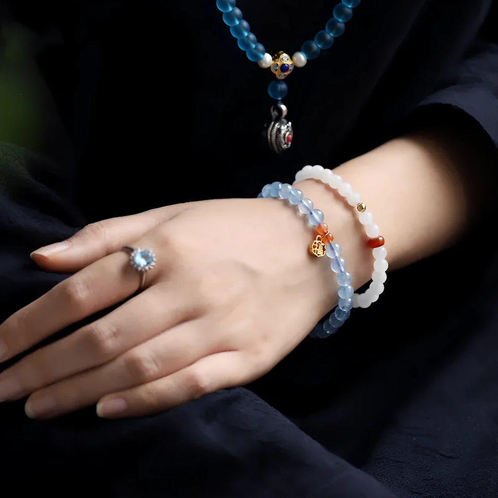 Women's ice translucent aquamarine crystal bracelet with 8mm round beads and blessing card detail