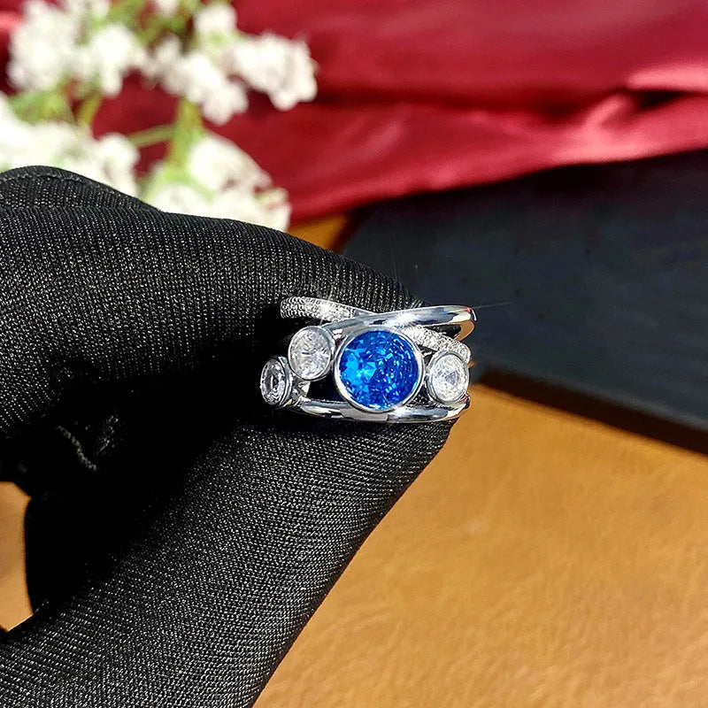 Retro hollow inlaid round copper ring in white gold colour with zircon stones