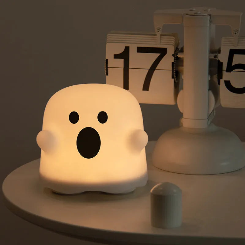 White silicone bedside night light with touch sensor base on wooden table
